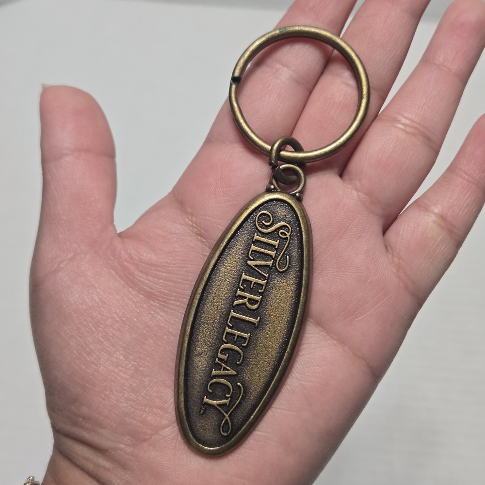 Vintage Silver Legacy Resort Casino Reno Nevada Brass Oval Souvenir Keychain Tag